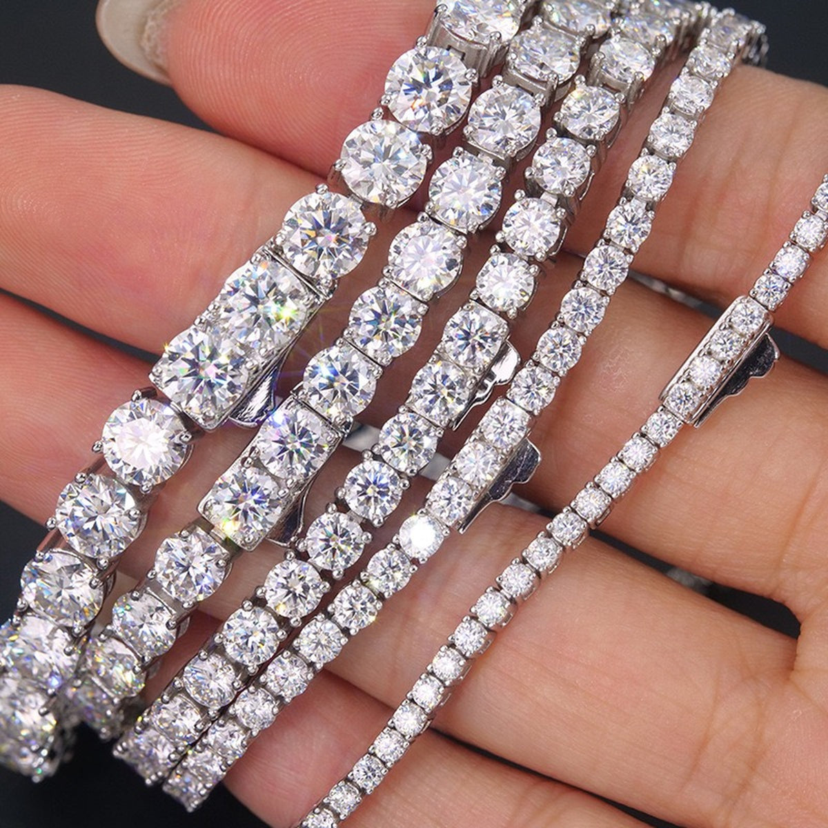 Close-up of four-prong settings in hand